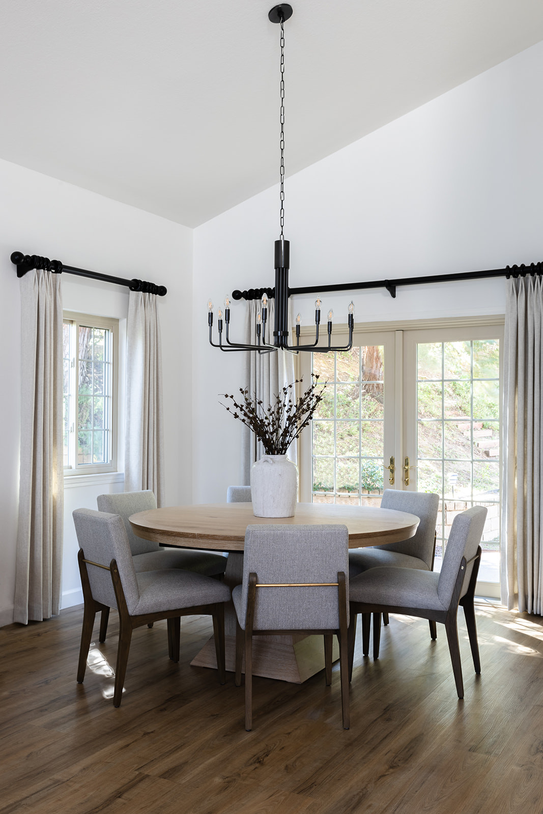 Dining room interior design with round shaped table and six chairs