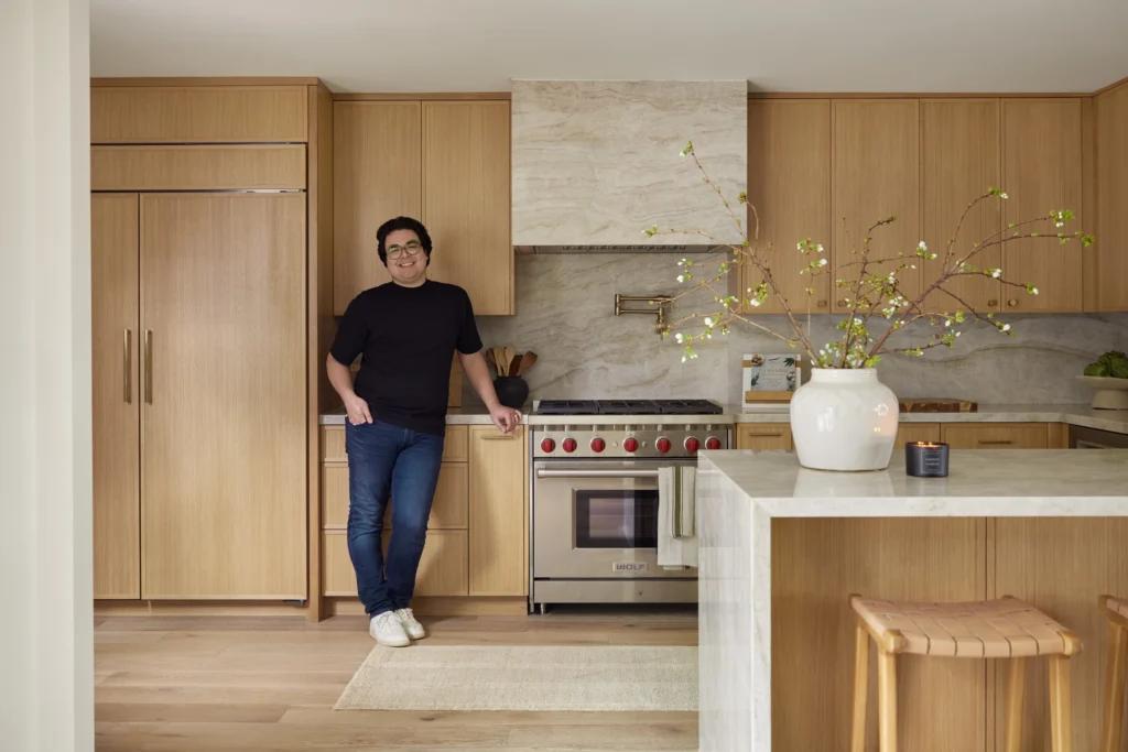 Ethan Charles standing in a well decorated room that feature beauty of timeless design